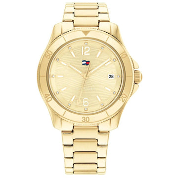Γυναικείο ρολόι Tommy Hilfiger Brooke 1782513, με μπρασελέ σε χρυσό χρώμα από ανοξείδωτο ατσάλι και χρυσό καντράν με λειτουργία ημερομηνίας.